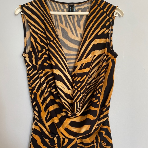 A tiger printed blouse and lower V neckline with a drape style at the front . - Picture 1 of 4